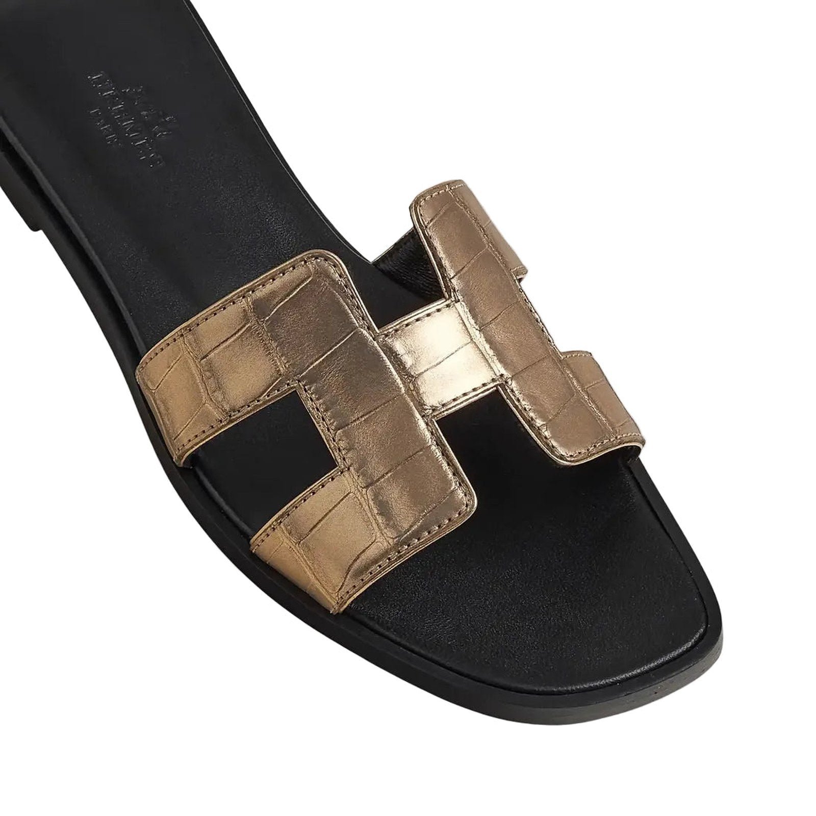 hermes-oran-sandal-in-alligator-skin-with-metallic-finish-dore-fonce-top_e756b2c9-50bc-4b09-bdc4-4fe7b98cc9e2.jpg