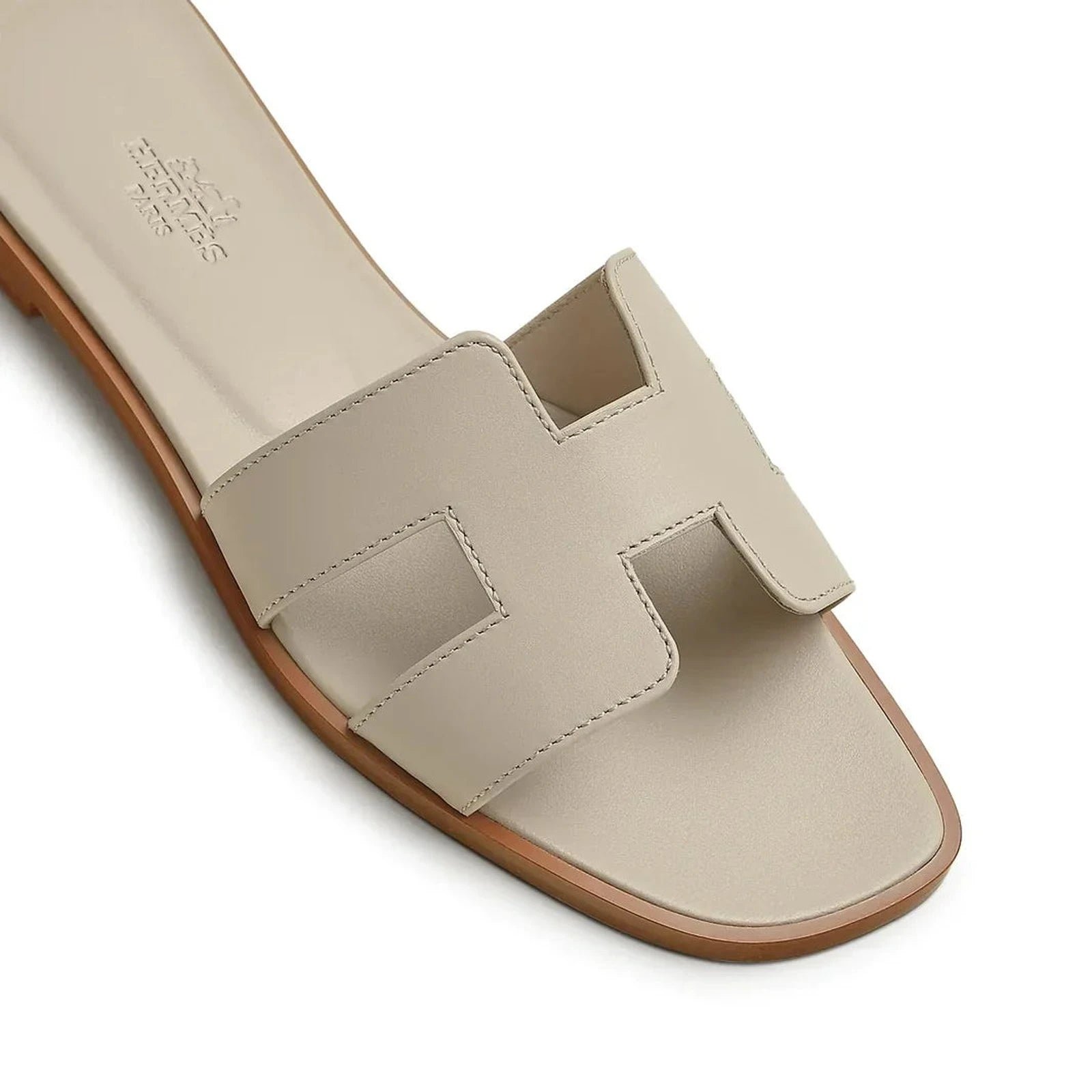 hermes-paris-oran-beige-nomade-sandal-h202230z-32370-detailed_316e5c0a-79a1-4f39-ba1c-a444d0d308b4.jpg