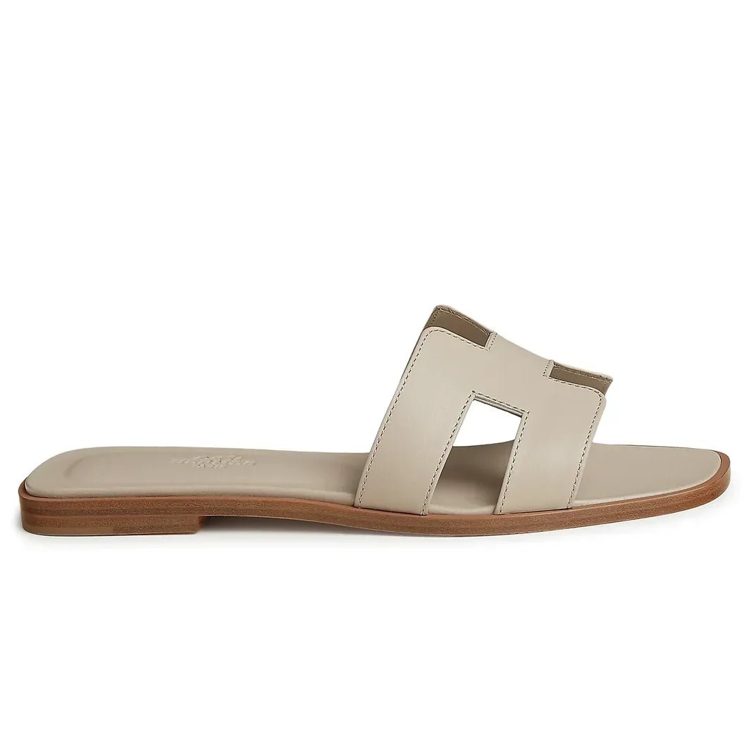 hermes-paris-oran-beige-nomade-sandal-h202230z-32370-side_4ef84790-12a7-4d61-b84c-a1dbc044035c.jpg